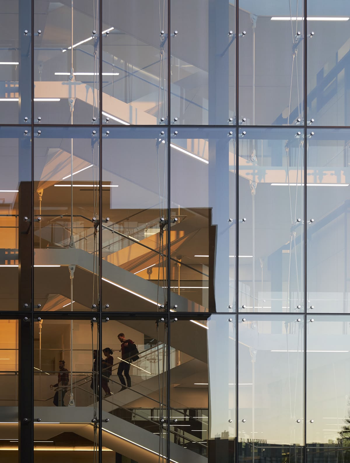 Spider-fitted frameless glass facade over an atrium